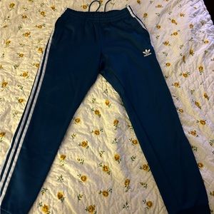 Great condition Adidas track pants. Bright blue green.